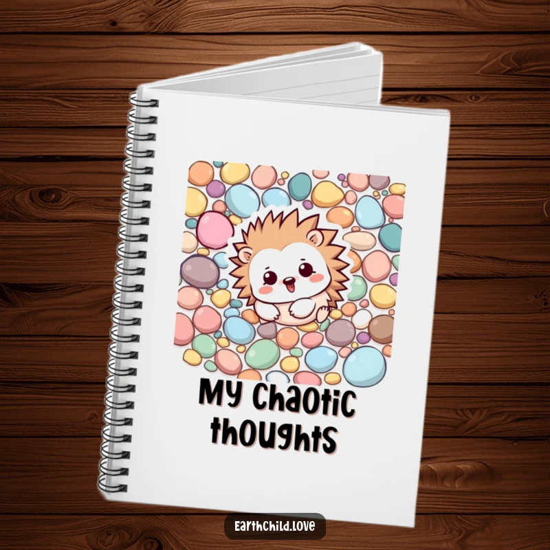 Funny Kawaii hedgehog character rolling playfully among colorful pebbles, a lined notebook for jotting down ideas.
